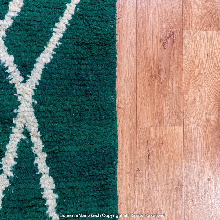 Green Moroccan rug with white tribal diamond lines and navy border, handmade in Beni Ourain wool style