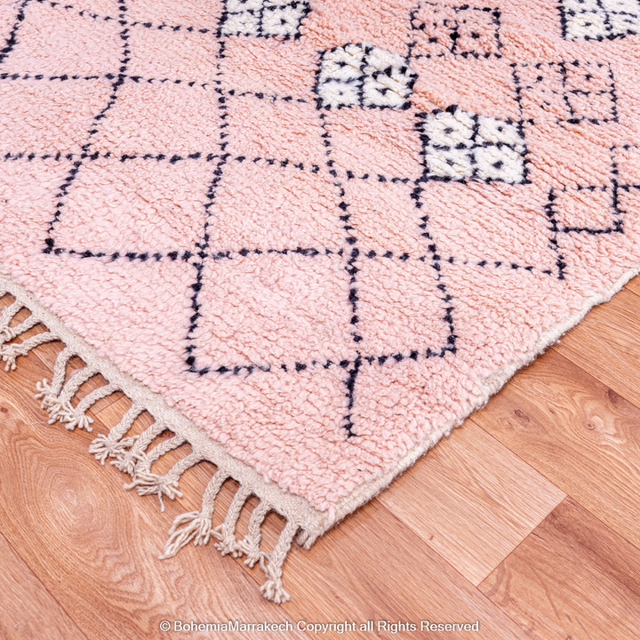 Pink Boujaad Moroccan rug with handwoven diamond tribal motifs in natural wool