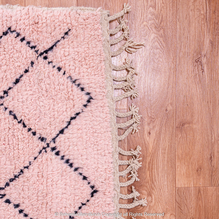 Pink Boujaad Moroccan rug with handwoven diamond tribal motifs in natural wool