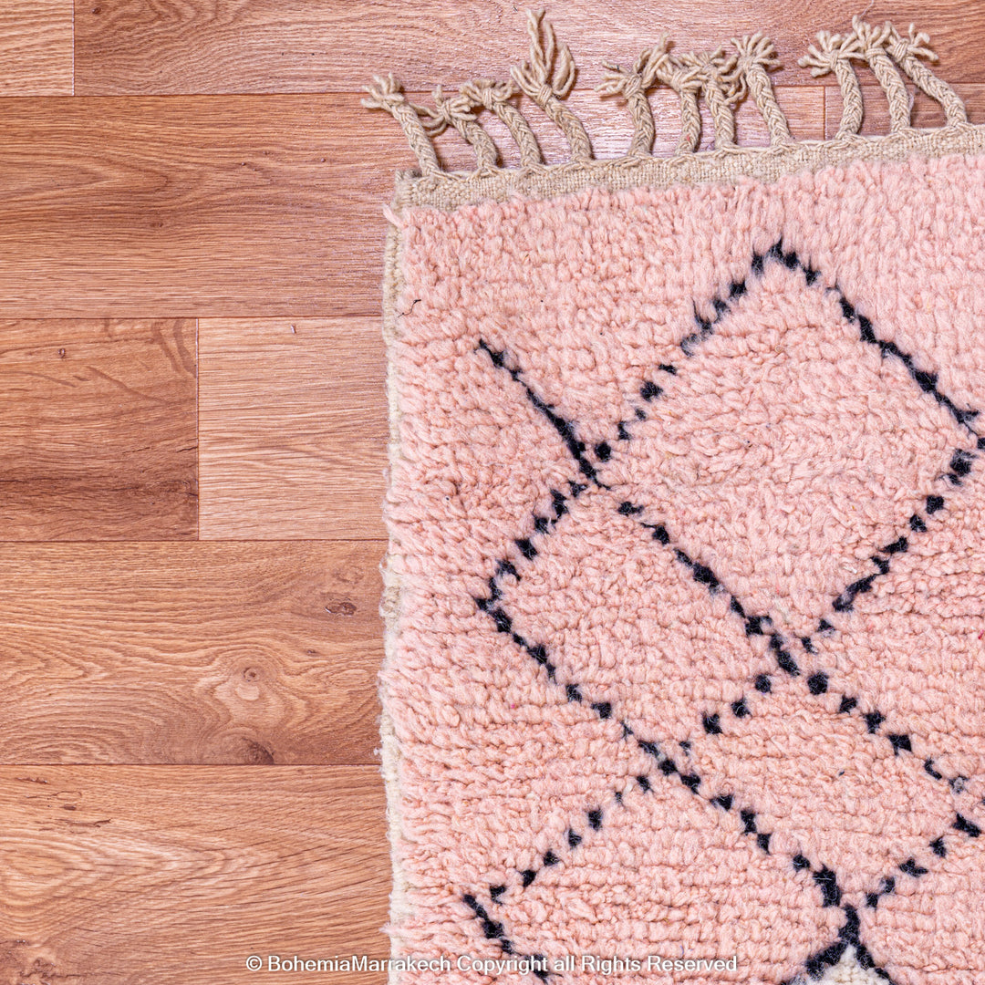 Pink Boujaad Moroccan rug with handwoven diamond tribal motifs in natural wool