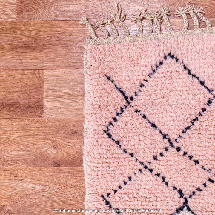 Pink Boujaad Moroccan rug with handwoven diamond tribal motifs in natural wool