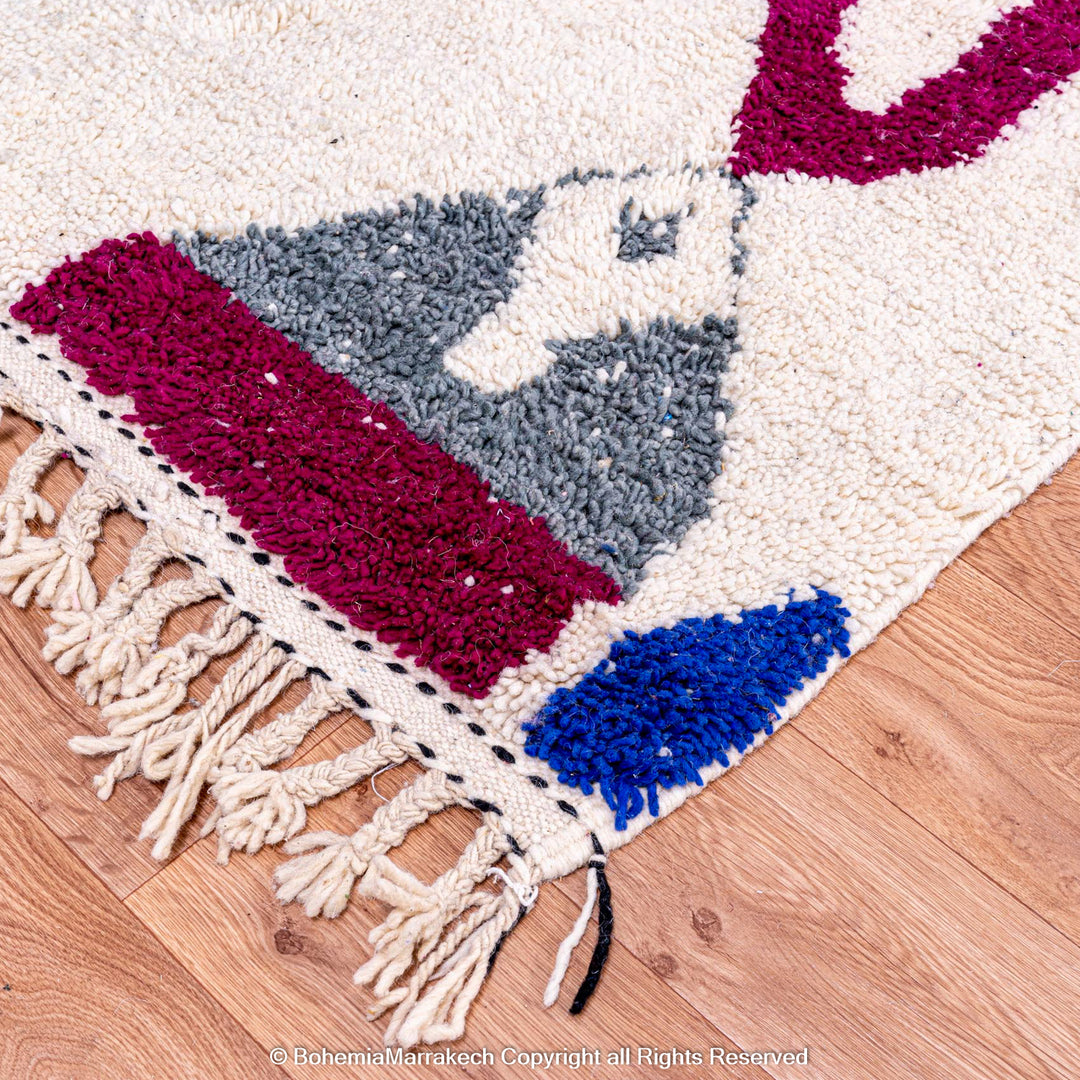 Handmade multicolored Moroccan wool rug with abstract geometric design