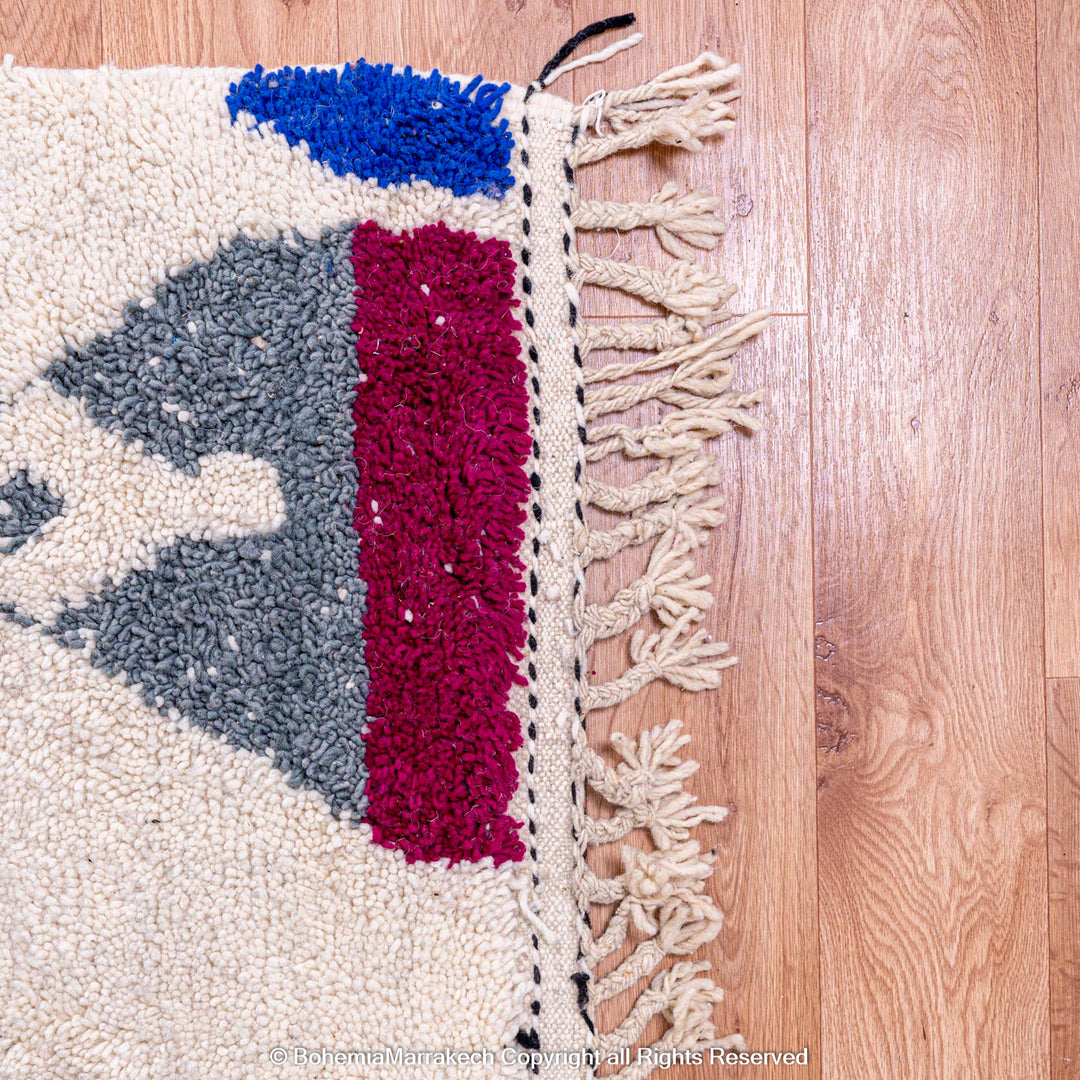 Handmade multicolored Moroccan wool rug with abstract geometric design