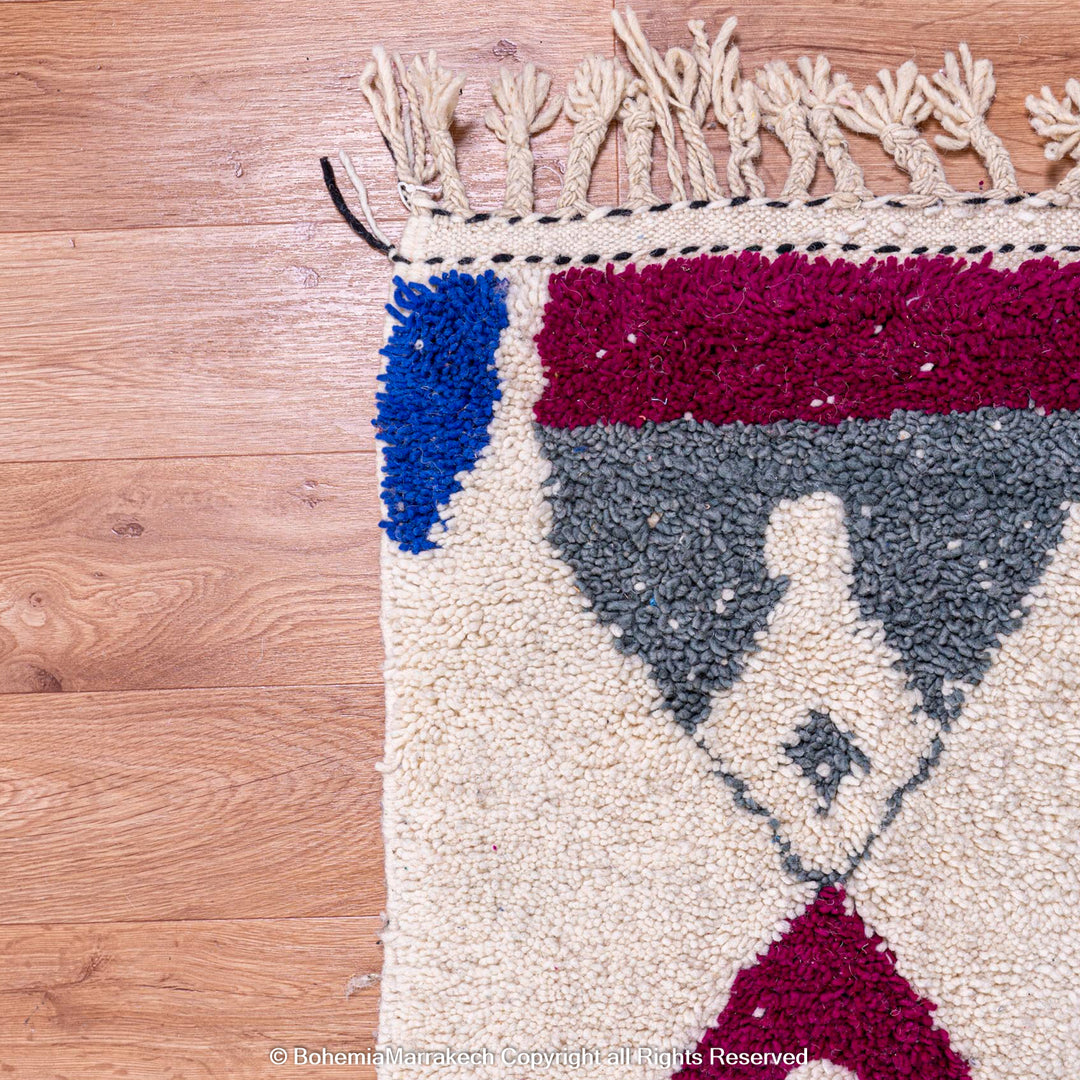 Handmade multicolored Moroccan wool rug with abstract geometric design