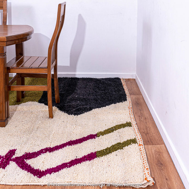 Handmade multicolored Moroccan wool rug with abstract geometric design