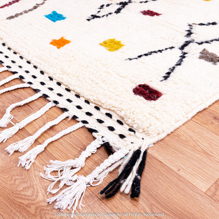 Abstract multicolored Azilal Moroccan rug with bold orange and yellow Berber motifs on wool background – handmade boho carpet