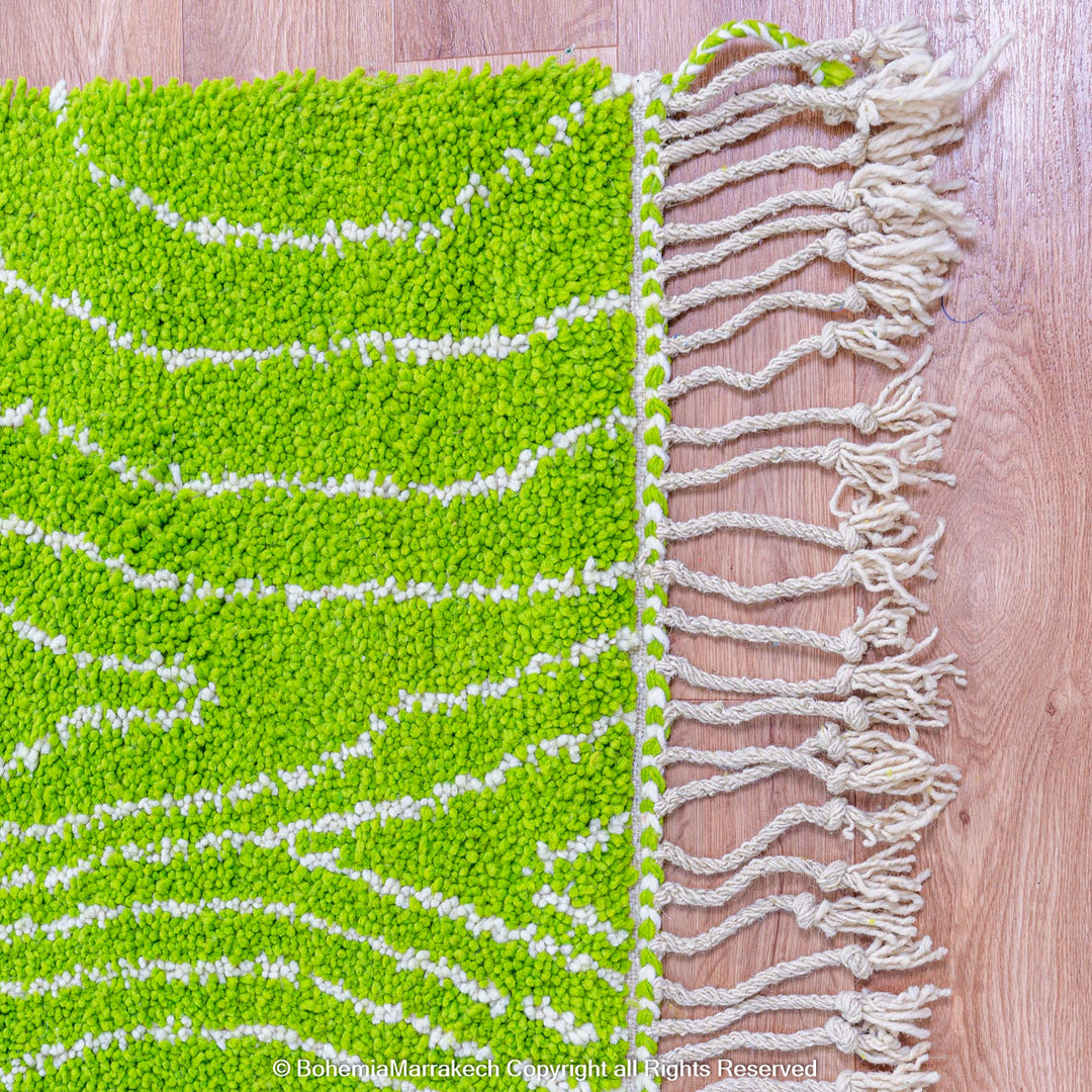 Green Moroccan wool rug with organic line patterns, handmade by Berber artisans