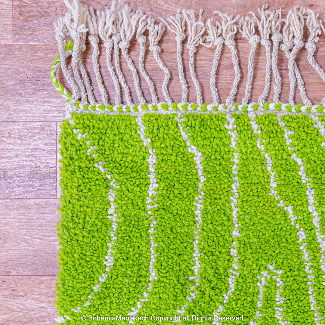 Green Moroccan wool rug with organic line patterns, handmade by Berber artisans
