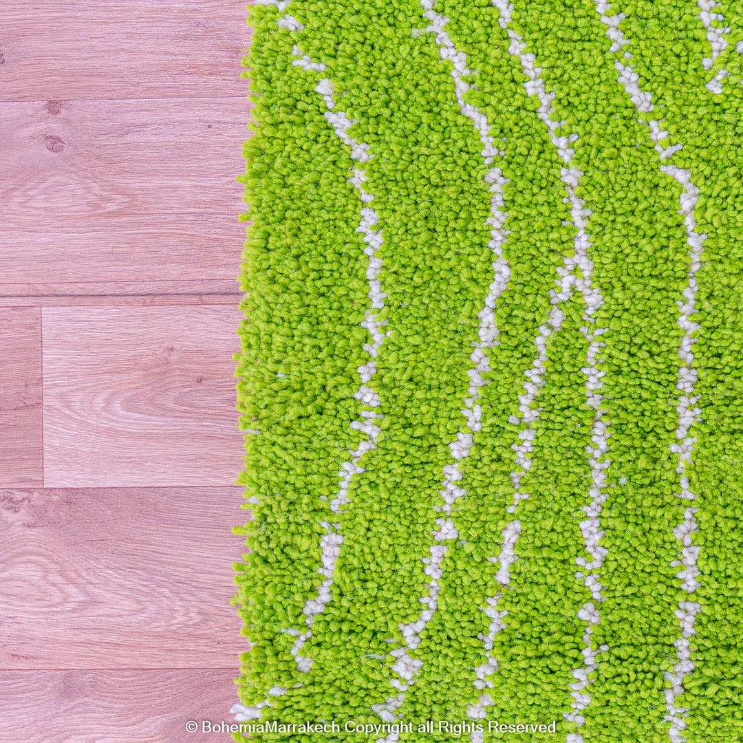 Green Moroccan wool rug with organic line patterns, handmade by Berber artisans