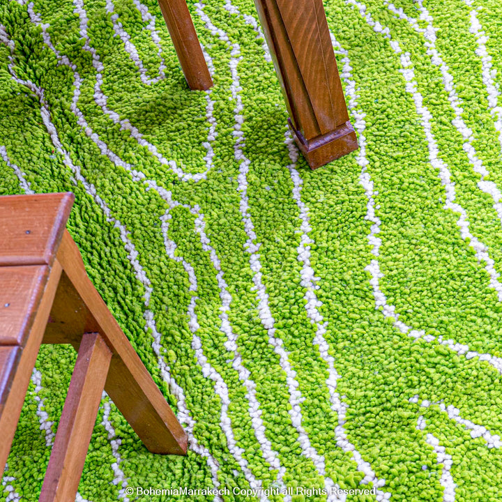 Green Moroccan wool rug with organic line patterns, handmade by Berber artisans