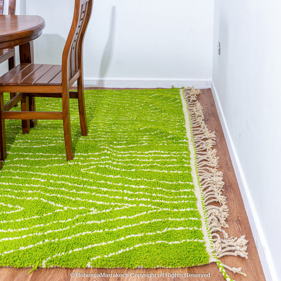 Green Moroccan wool rug with organic line patterns, handmade by Berber artisans