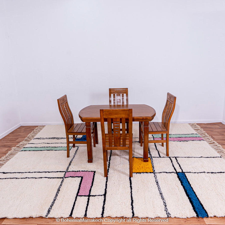 Modern Color Block Moroccan Rug with colorful rectangular blocks under wooden dining set