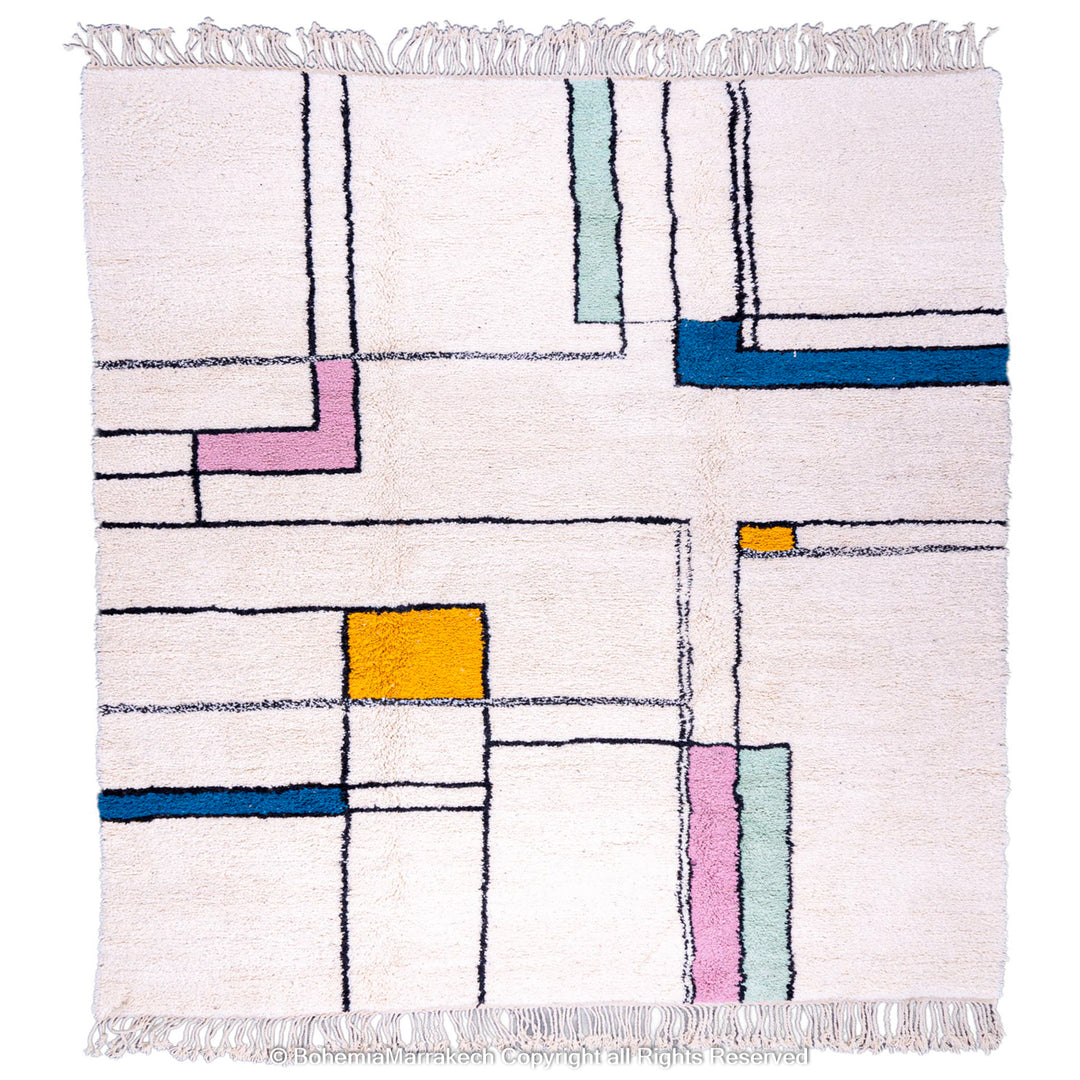 Modern Moroccan wool rug with colorful blocks on ivory background, handmade by Berber artisans. Available in 8x10. Moroccan rug for sale.