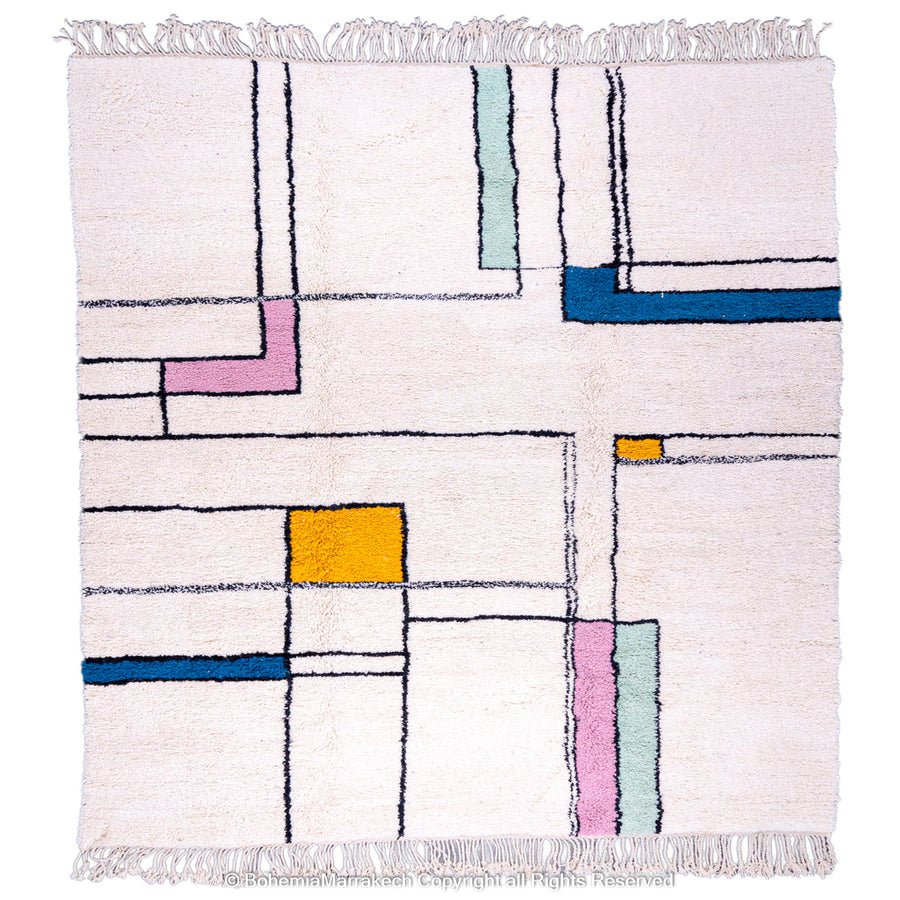 Modern Moroccan wool rug with colorful blocks on ivory background, handmade by Berber artisans. Available in 8x10. Moroccan rug for sale.