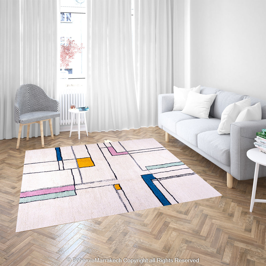 Modern Color Block Moroccan Rug in living room with ivory background and colorful blocks of yellow, blue, pink, and mint green.