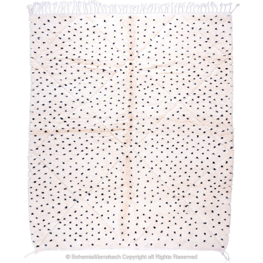 White Moroccan Beni Ourain rug with black dots, handmade from natural wool, perfect for modern and traditional interiors.