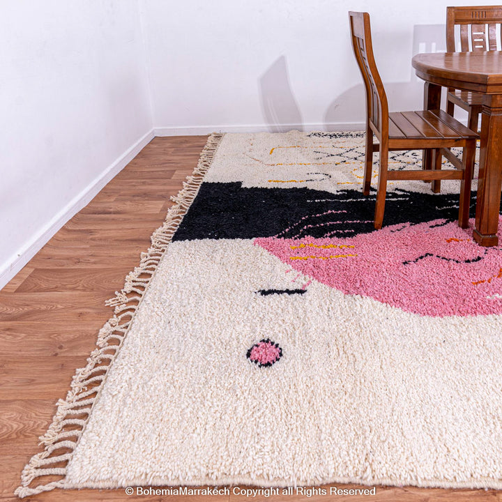 Abstract Face Moroccan Rug, handmade wool art carpet, featuring a hand-drawn face design with pink, yellow, and black elements.