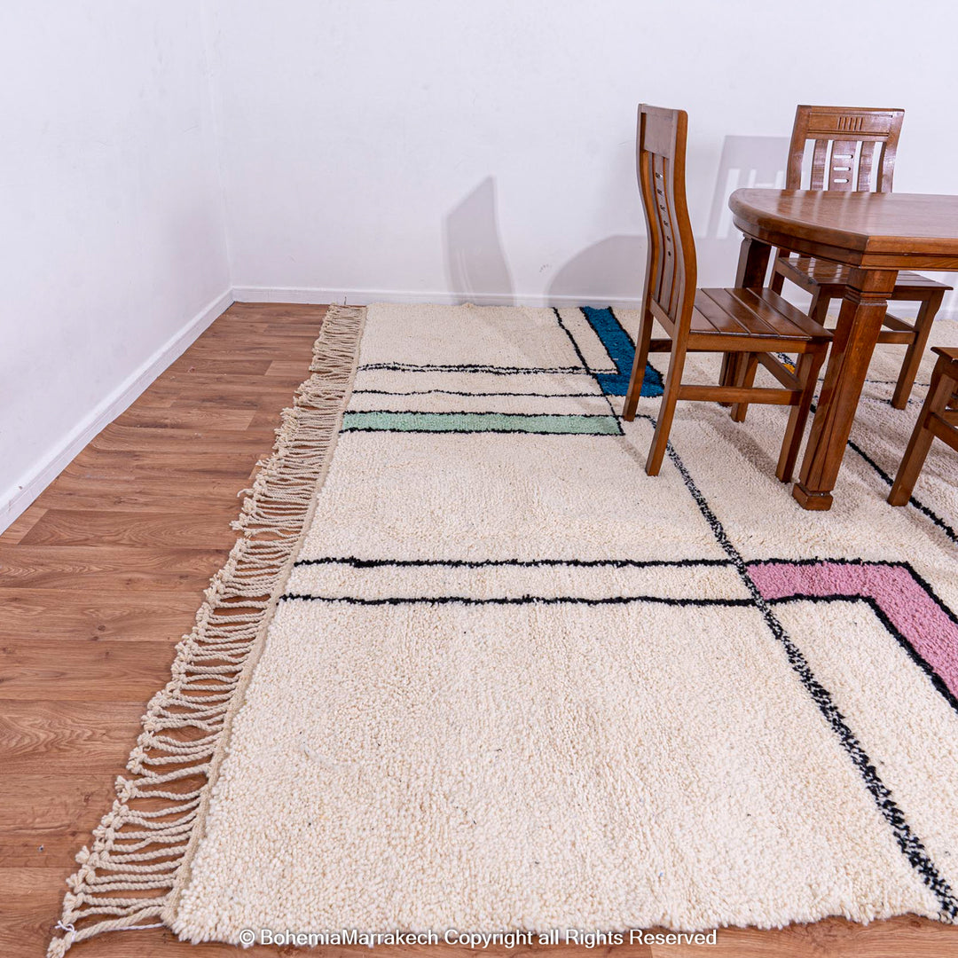 Modern Color Block Moroccan Rug with vibrant blocks, handwoven from wool by Berber artisans, displayed with wooden dining set.