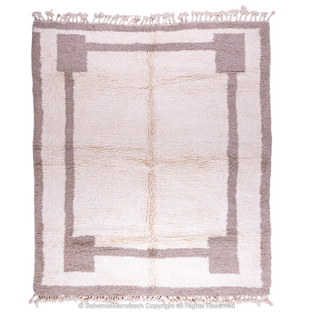 Minimalist Moroccan wool rug with beige border design on cream background