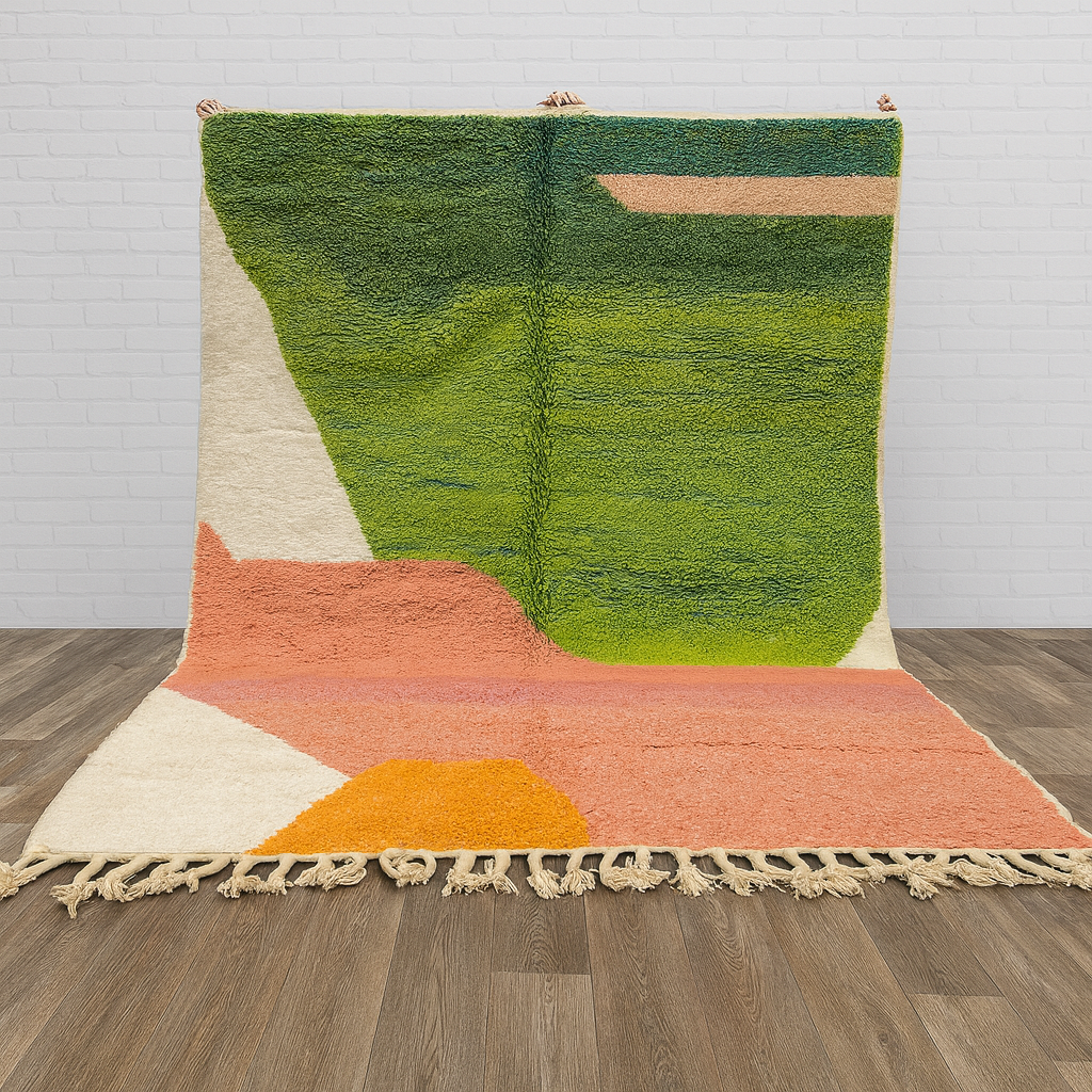 Multicolored geometric rug on a wooden floor with a white brick wall background