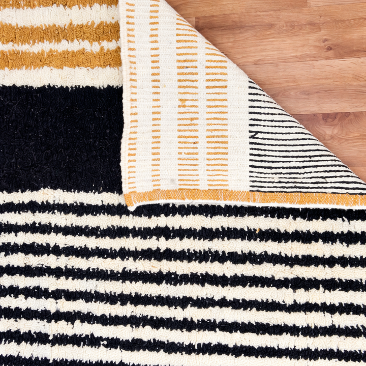 handwoven modern geometric moroccan wool rug with abstract striped and grid pattern