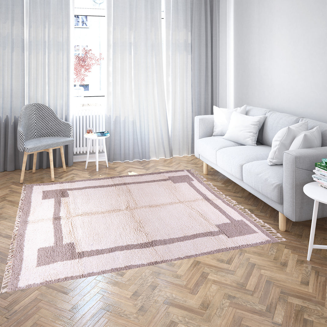 Minimalist Moroccan wool rug with beige border design on cream background