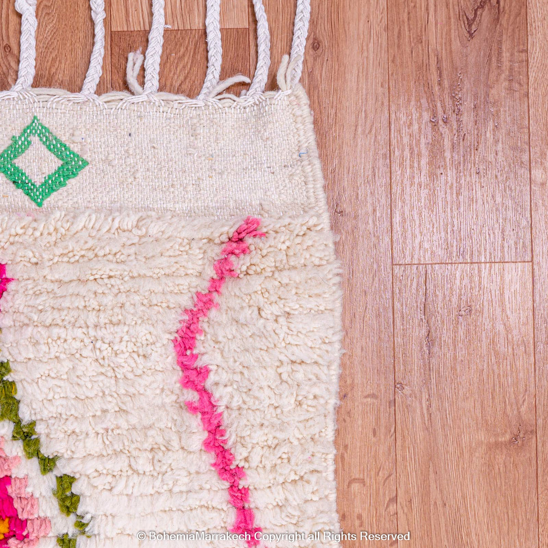 Colorful Moroccan rug with Azilal diamond motifs and vibrant colors on wool, perfect for bohemian interiors or creative spaces.