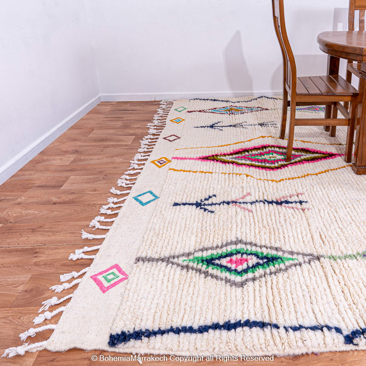 Handwoven colorful Moroccan rug with Azilal diamond motifs, vibrant tribal patterns, ideal for bohemian interiors.