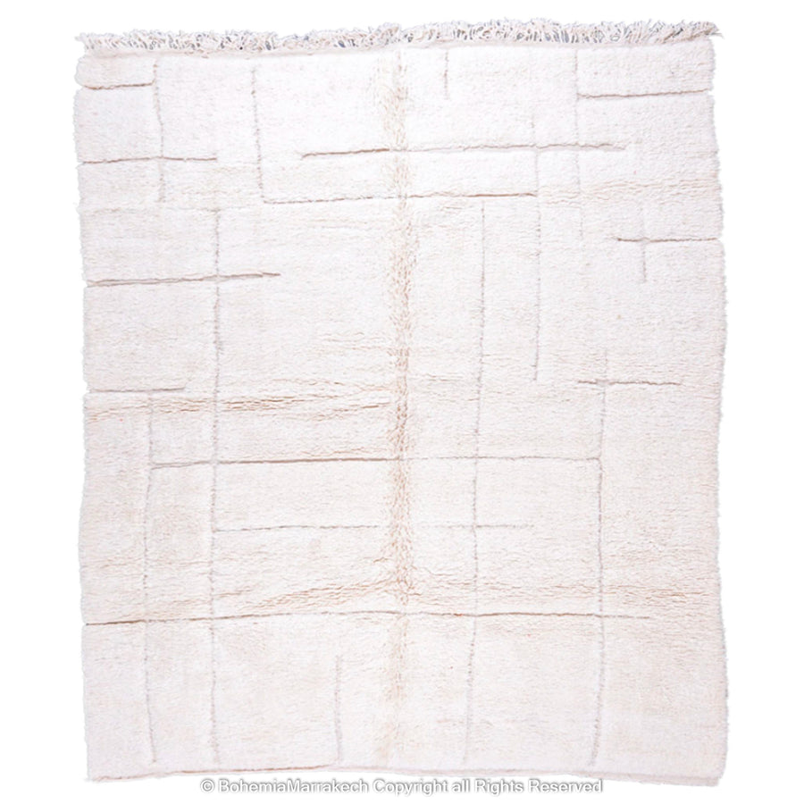 Minimalist Moroccan rug in off-white with a subtle grid pattern, handmade from natural wool by Berber artisans, ideal for modern decor.