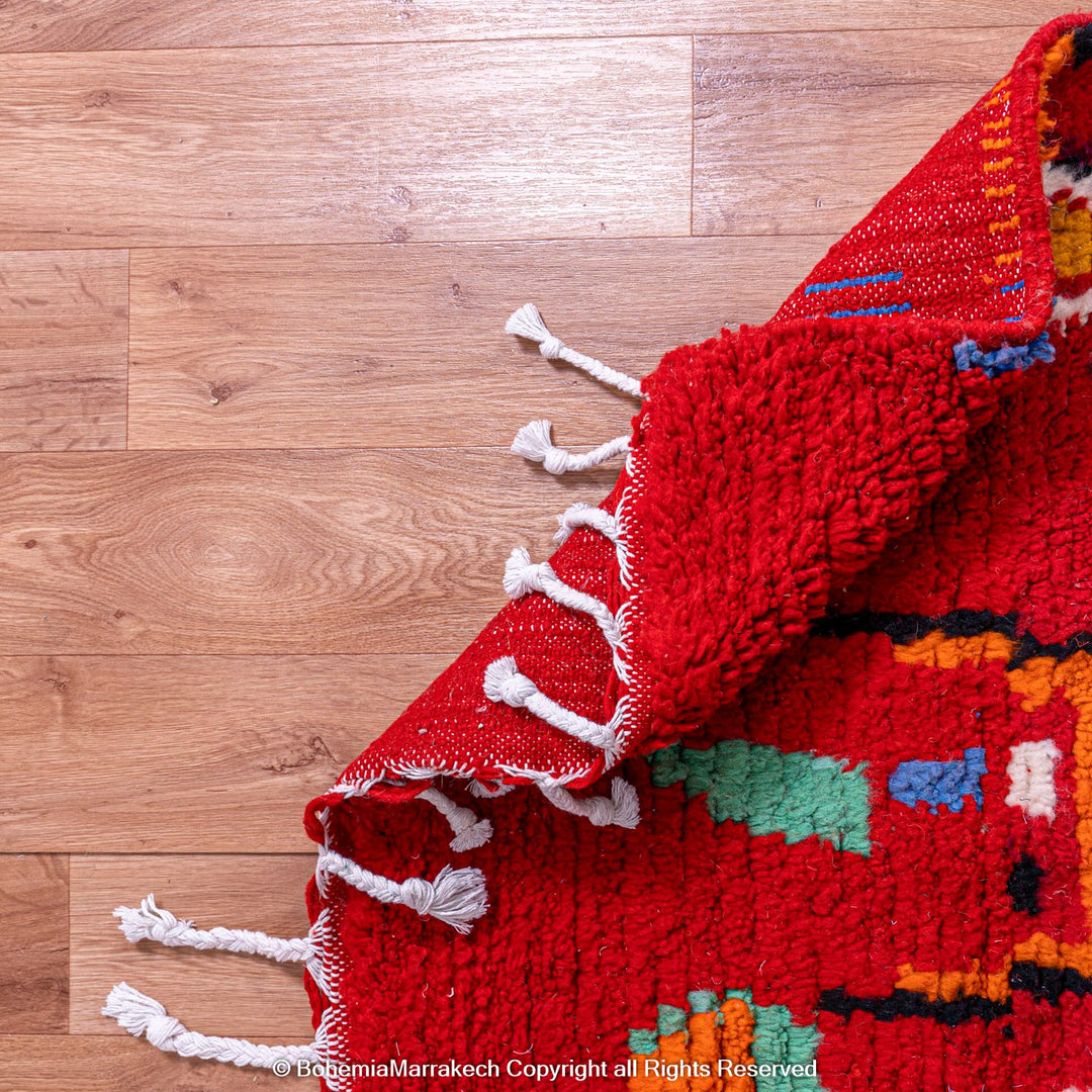 Colorful red Moroccan Boujaad rug with tribal Berber motifs and geometric patterns, handmade in wool