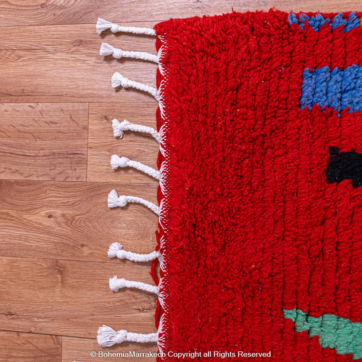 Colorful red Moroccan Boujaad rug with tribal Berber motifs and geometric patterns, handmade in wool