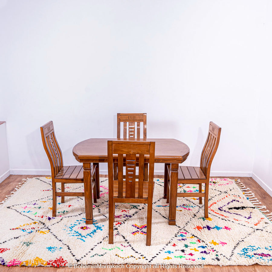 White Moroccan wool rug with multicolor tribal symbols and diamond pattern