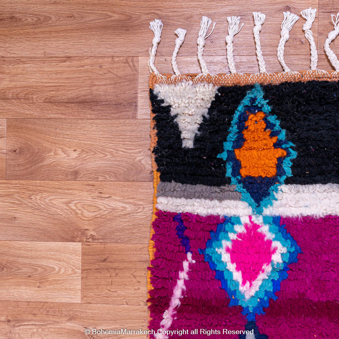 Pink abstract Moroccan wool rug with tribal and checkerboard motifs
