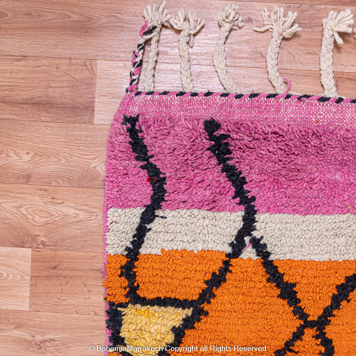 Handmade multicolor Moroccan wool rug with abstract geometric shapes in orange, blue, pink, and brown tones