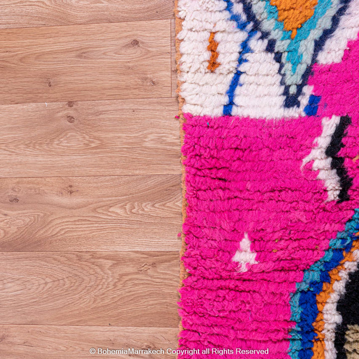 Pink abstract Moroccan wool rug with tribal and checkerboard motifs