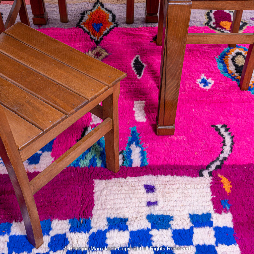 Pink abstract Moroccan wool rug with tribal and checkerboard motifs