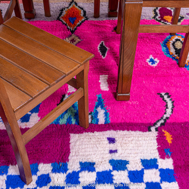 Pink abstract Moroccan wool rug with tribal and checkerboard motifs