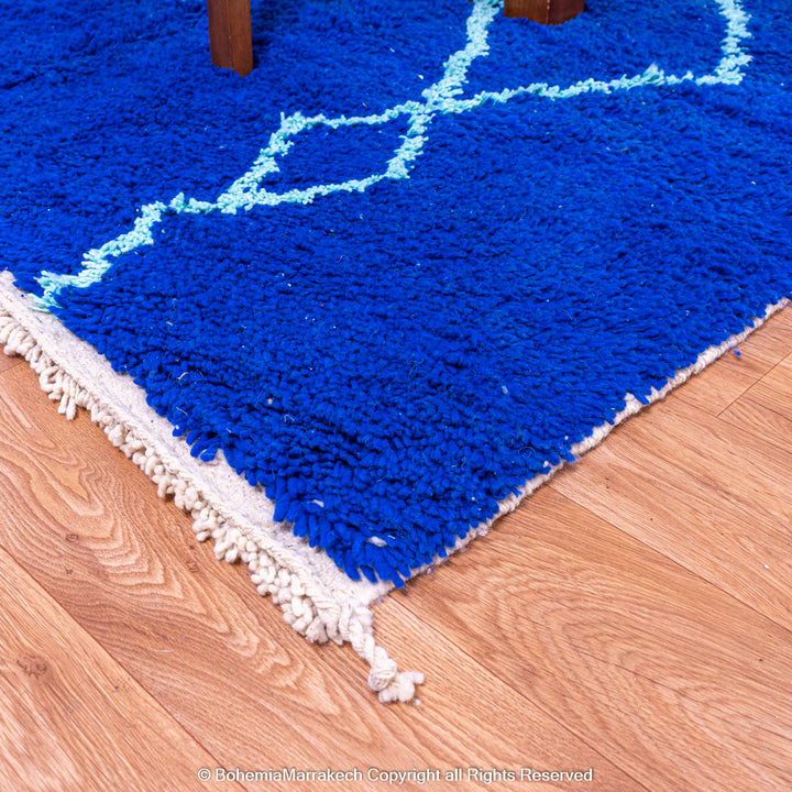 Blue Moroccan wool rug with handwoven Berber diamond pattern