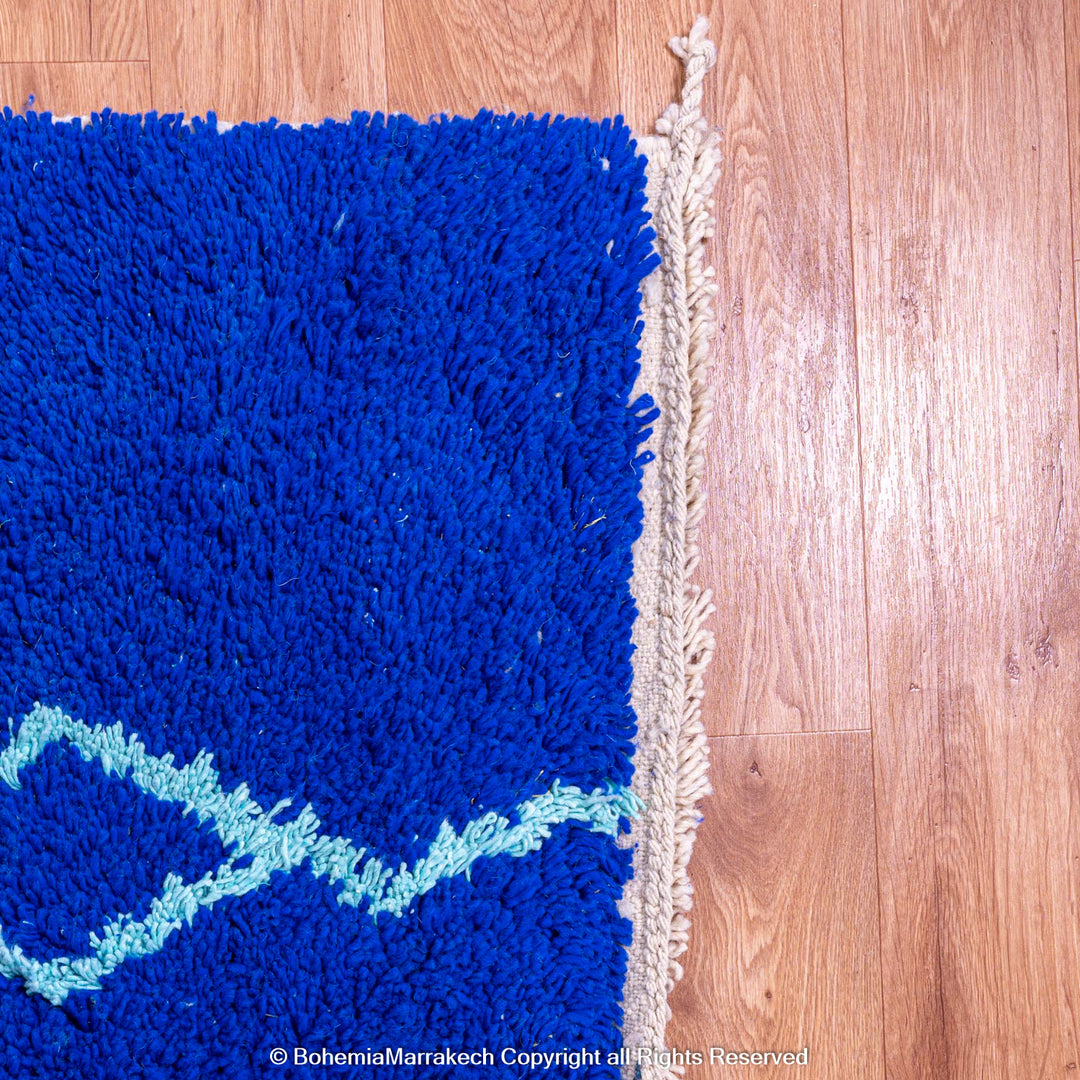 Blue Moroccan wool rug with handwoven Berber diamond pattern
