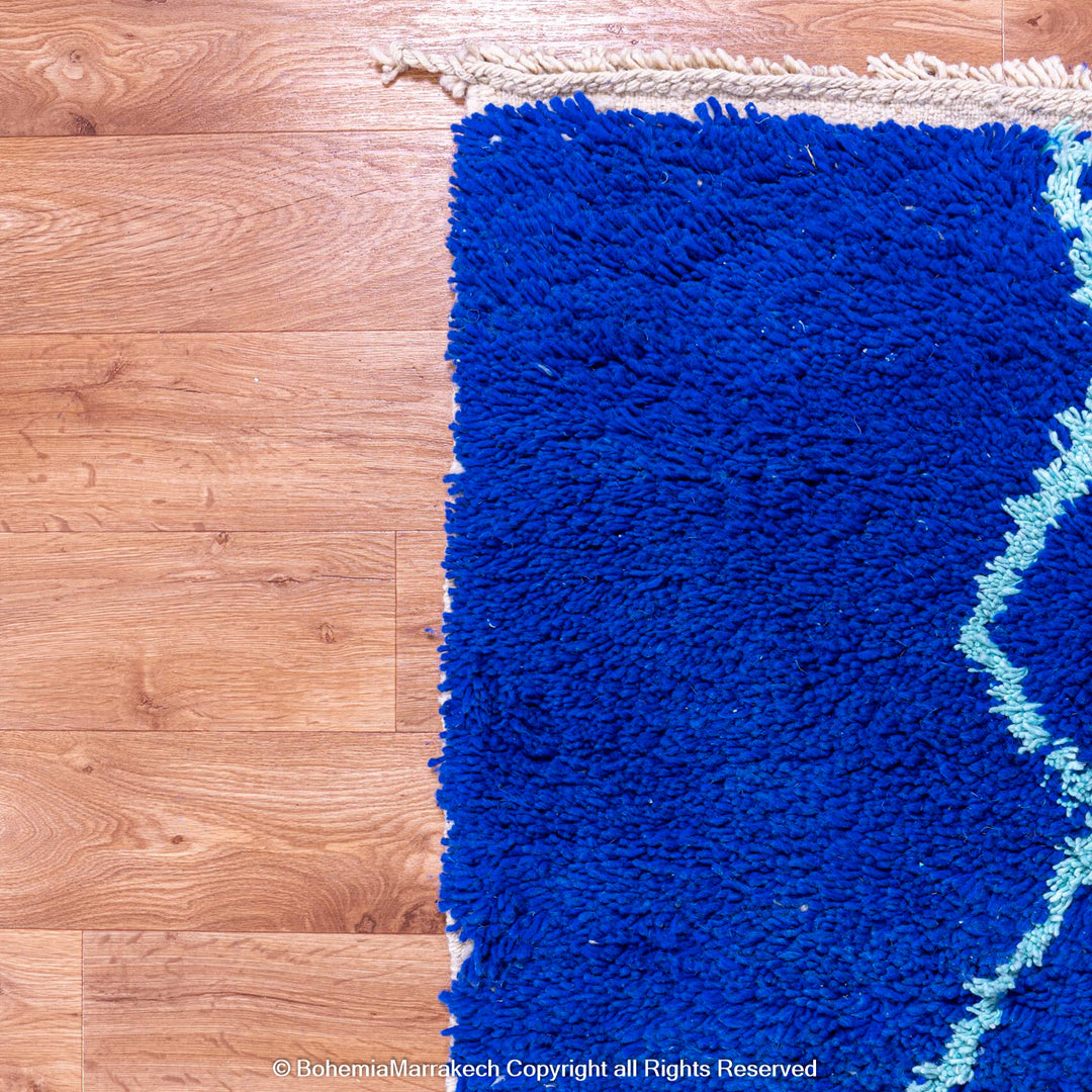 Blue Moroccan wool rug with handwoven Berber diamond pattern
