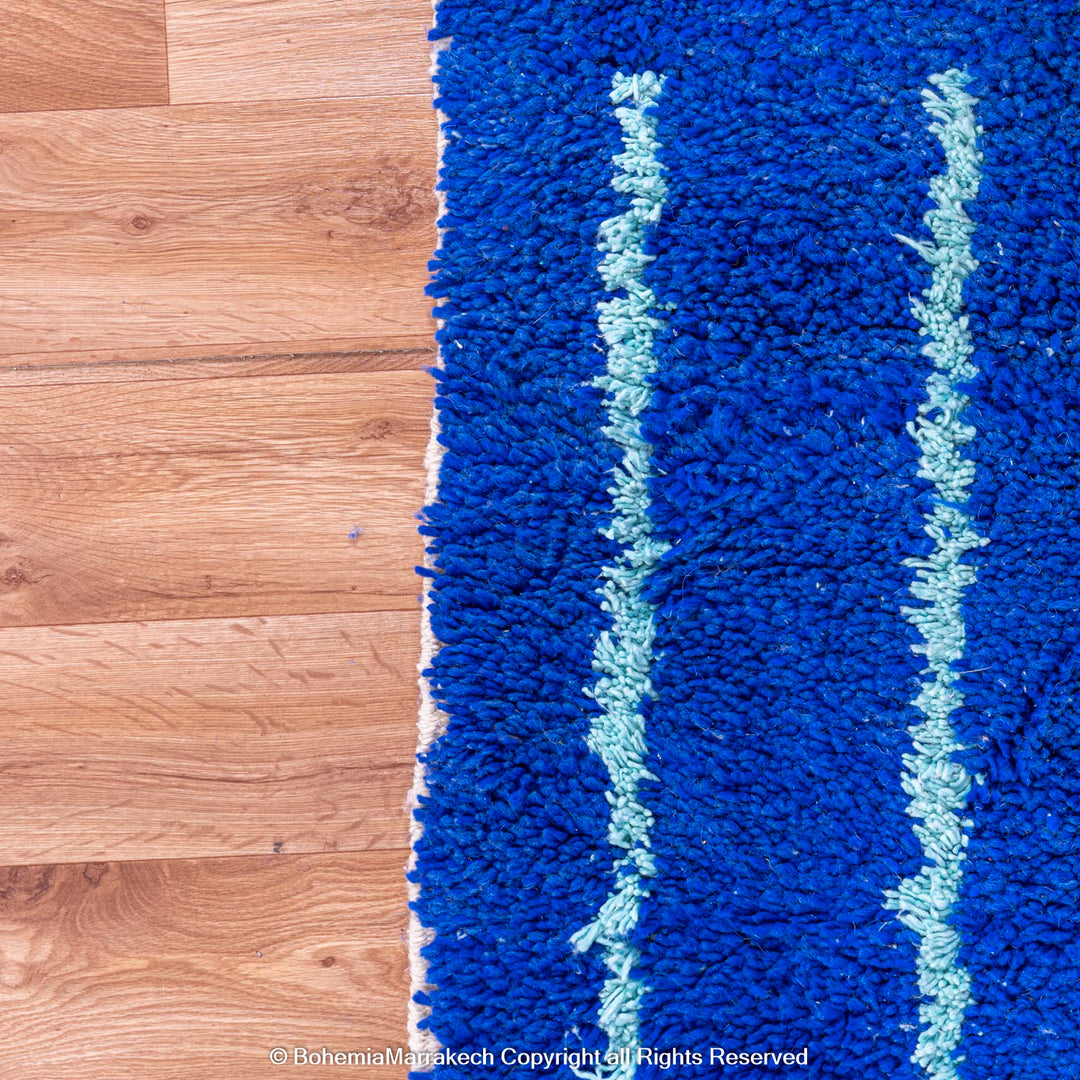 Blue Moroccan wool rug with handwoven Berber diamond pattern
