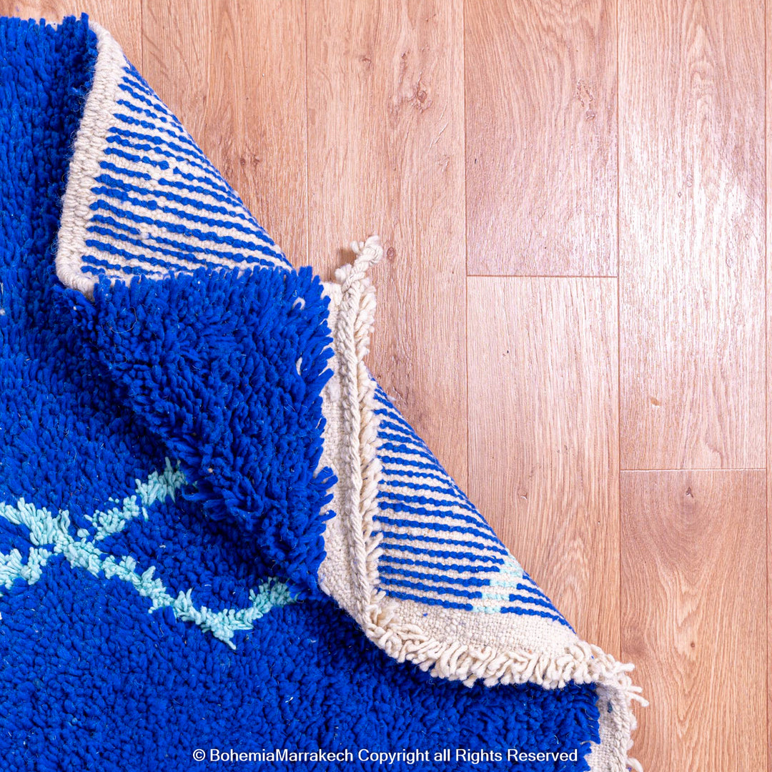 Blue Moroccan wool rug with handwoven Berber diamond pattern