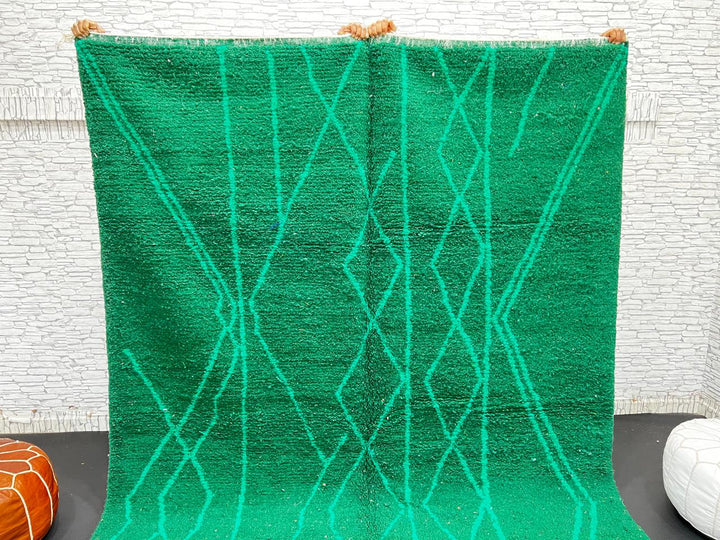 Emerald green Moroccan wool rug with diamond pattern, handmade by Berber artisans in Morocco