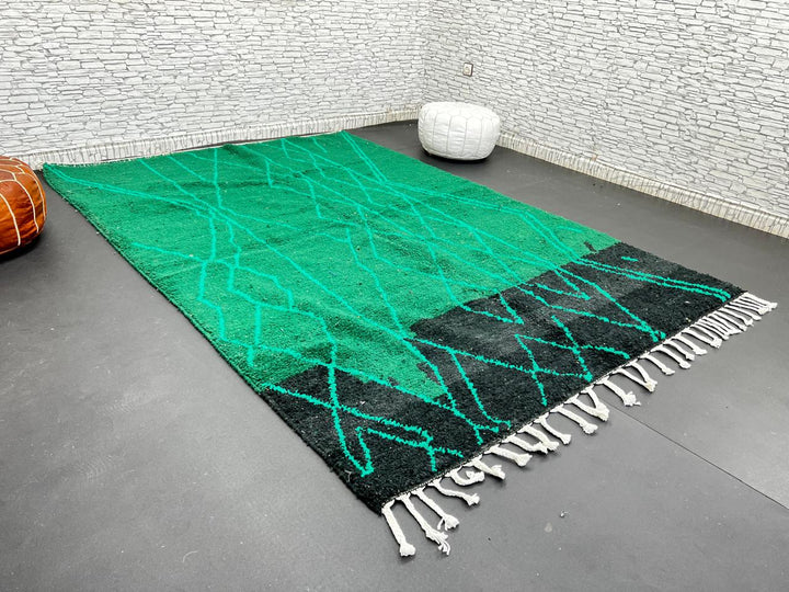 Emerald green Moroccan wool rug with diamond pattern, handmade by Berber artisans in Morocco