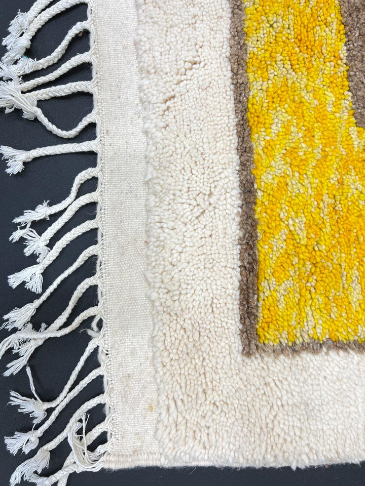 Colorful geometric Moroccan wool runner rug with red, green, yellow, blue, and cream abstract pattern