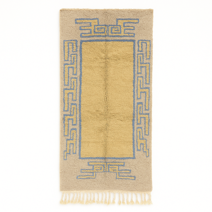 Golden Moroccan wool runner rug with blue geometric border and neutral background, handmade by Berber artisans
