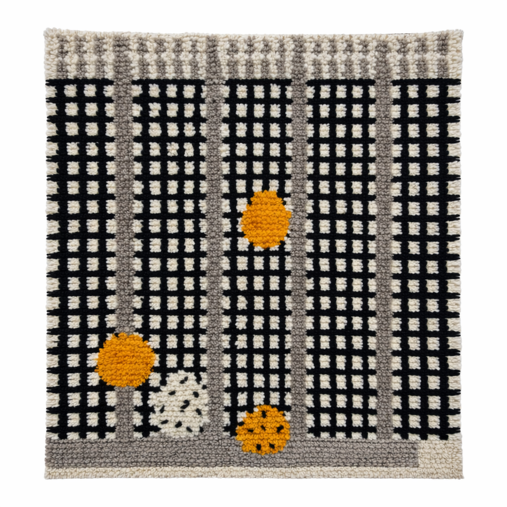 Handmade Moroccan wool rug with black grid and amber dot design. Soft plush texture, modern style, and artisan crafted.