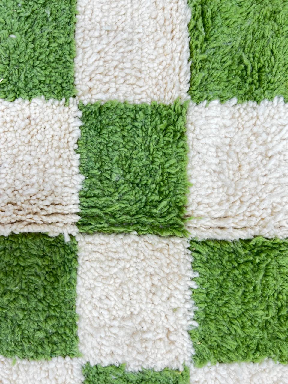 Handmade Moroccan runner rug with green and white checkerboard pattern, crafted from natural wool by Berber artisans.
