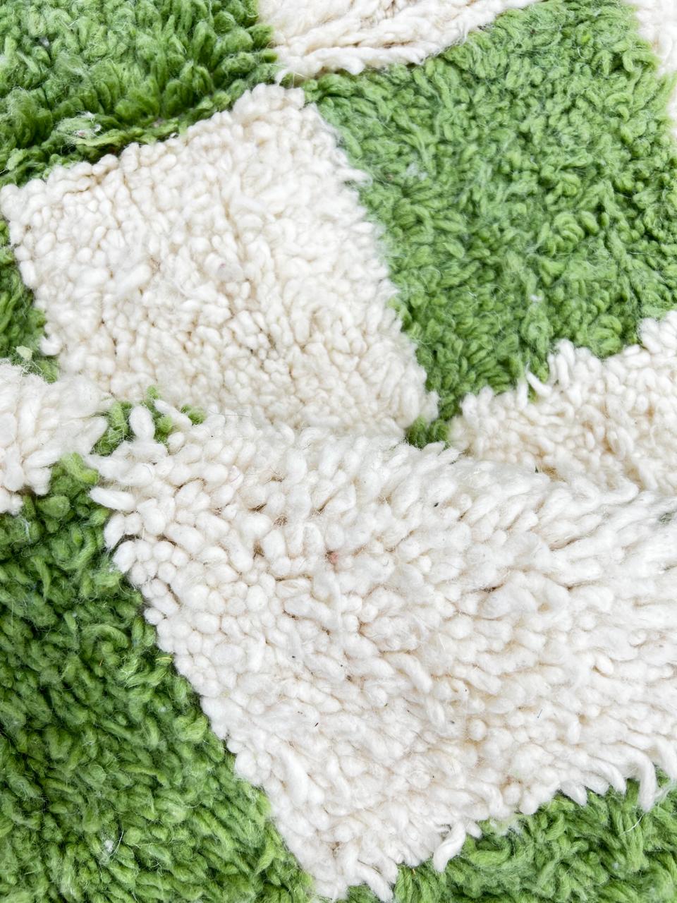 Handmade Moroccan runner rug with green and white checkerboard pattern, crafted from natural wool by Berber artisans.