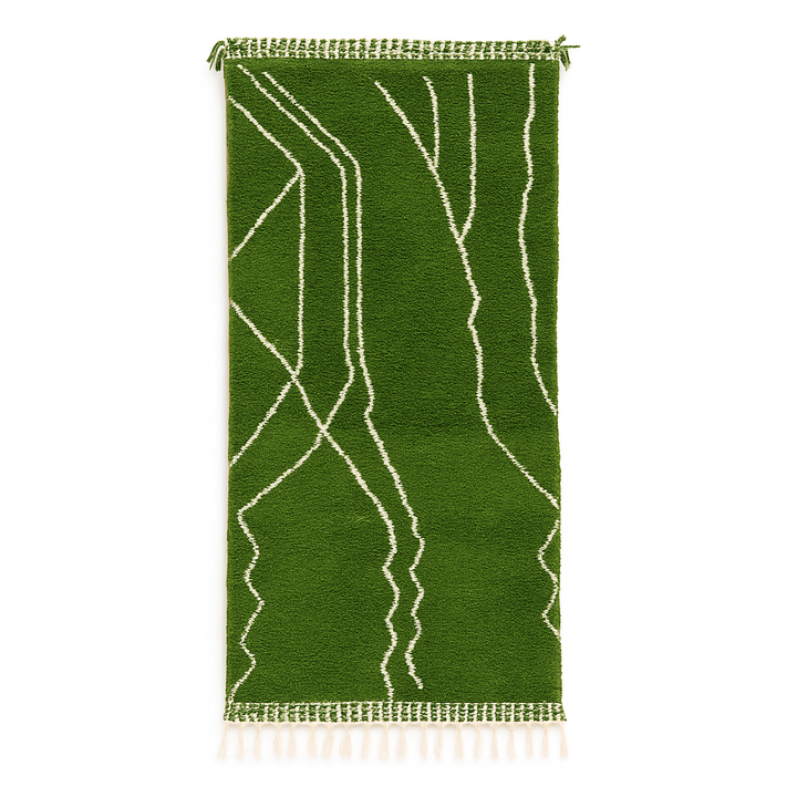 Handmade green Moroccan runner rug with white abstract linear design on natural wool.